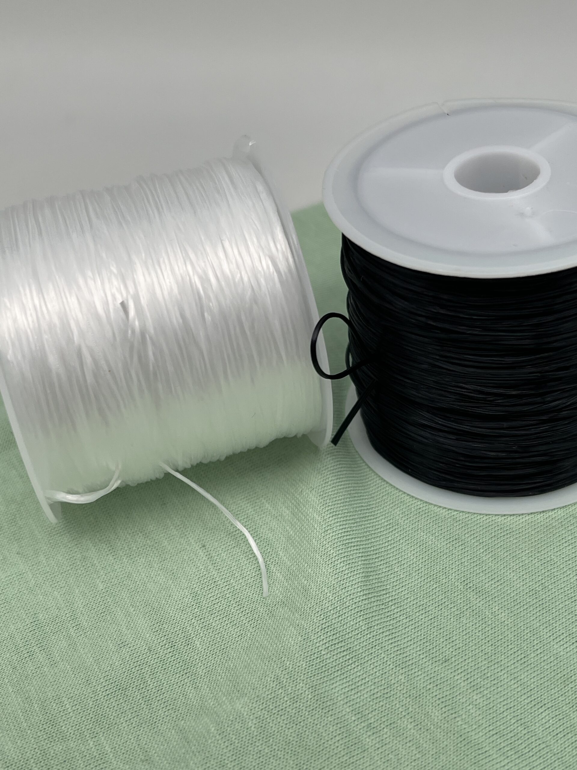 Bobines de fil élastique blanc et noir multi brins pour création de bijoux